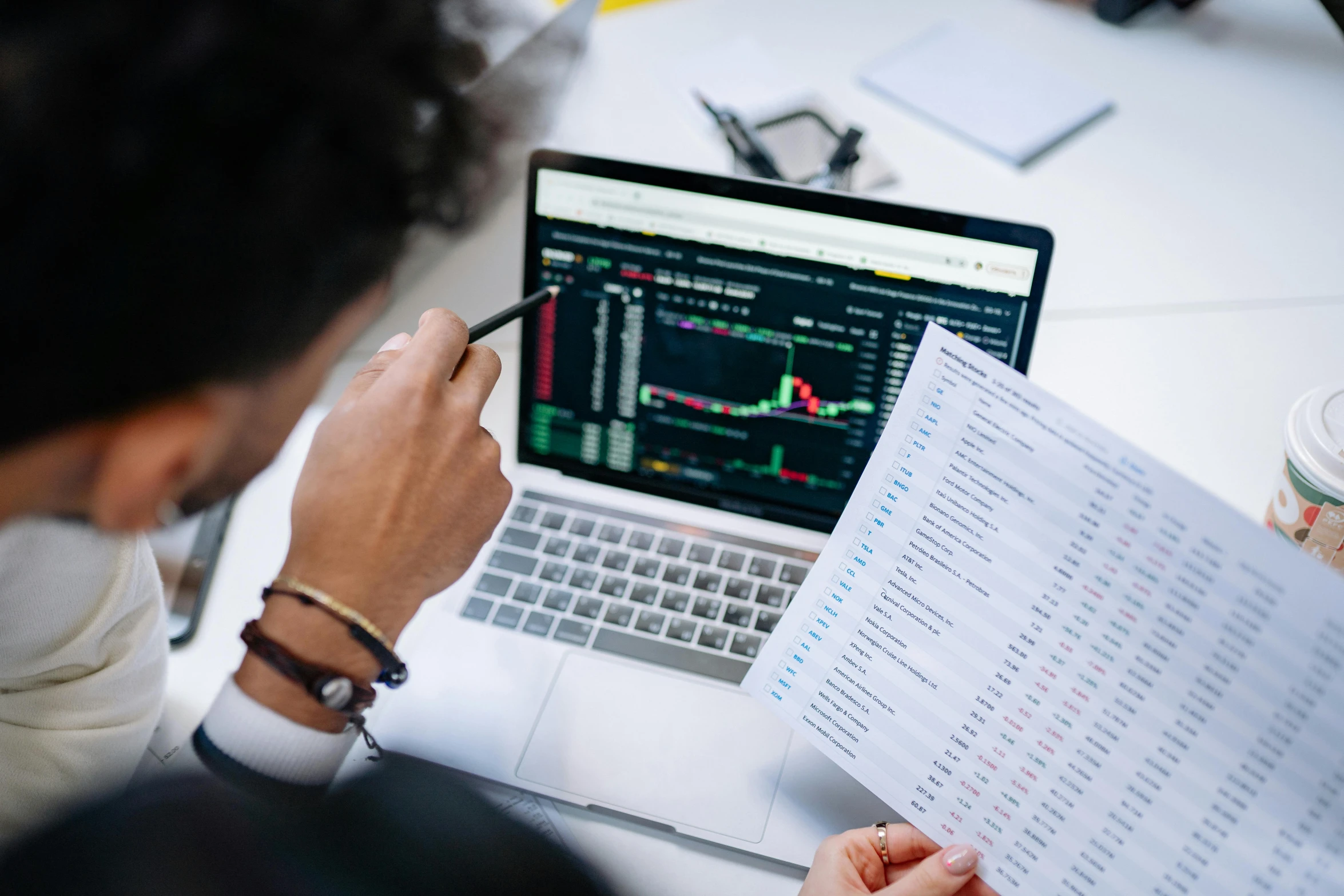 a man sitting in front of a laptop computer, pexels contest winner, analytical art, displaying stock charts, listing image, no - text no - logo, coding