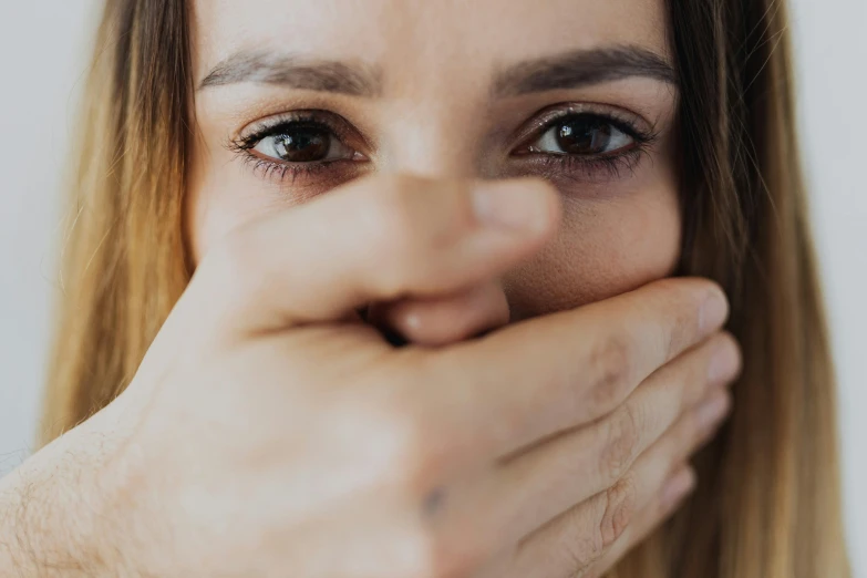 a woman covering her face with her hands, trending on pexels, antipodeans, closeup. mouth open, bandage taped fists, wide eyed, prompt young woman