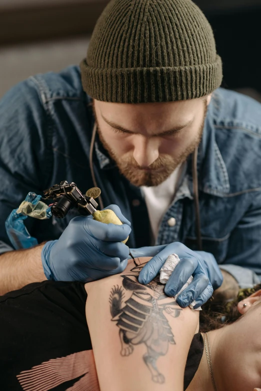 a man getting a tattoo on a woman's arm, a tattoo, trending on pexels, hyperrealism, blue ink, stitching, ilustration, multi-part