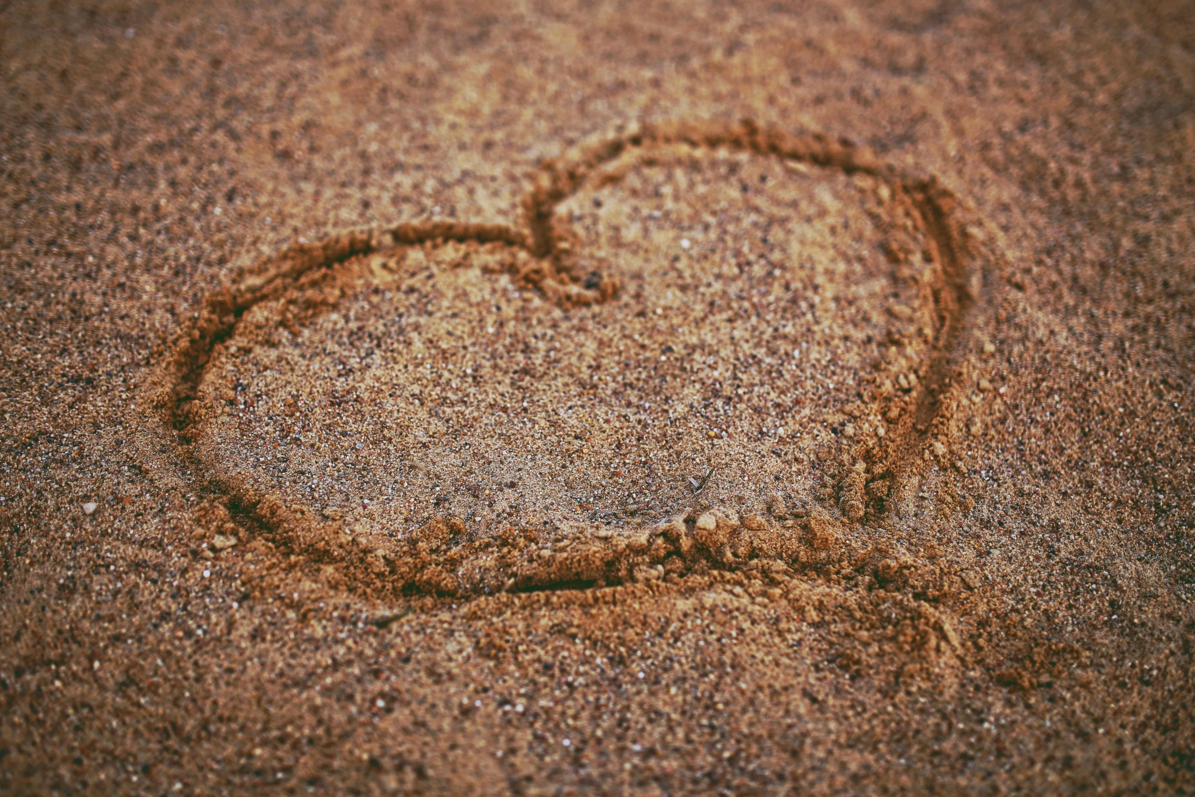 a heart drawn in the sand on a beach, trending on pixabay, graffiti, brown, fan favorite, vanilla, sparkling