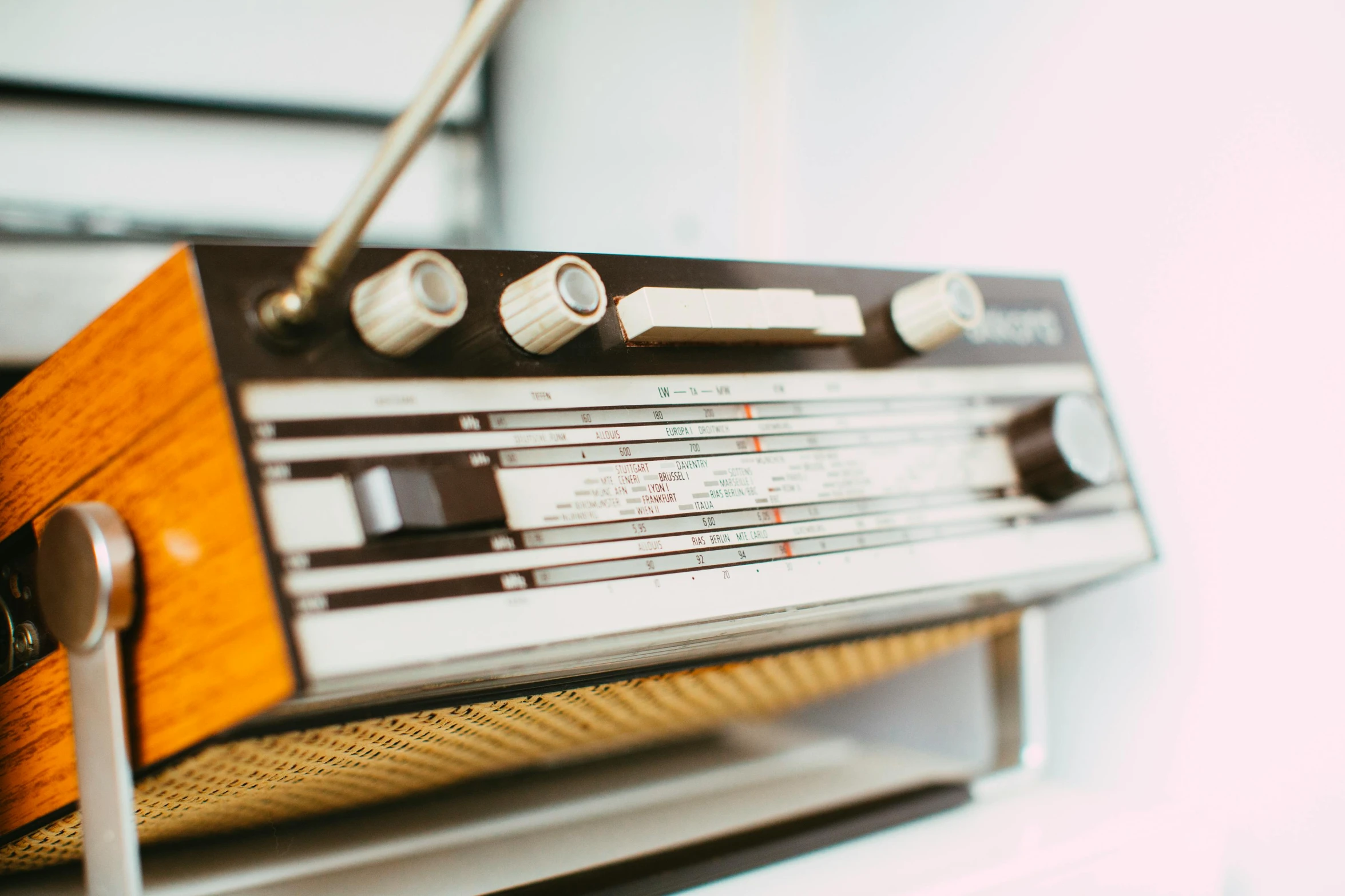 an old fashioned radio sitting on top of a shelf, trending on pexels, high angle close up shot, brightly-lit, an instrument, icon
