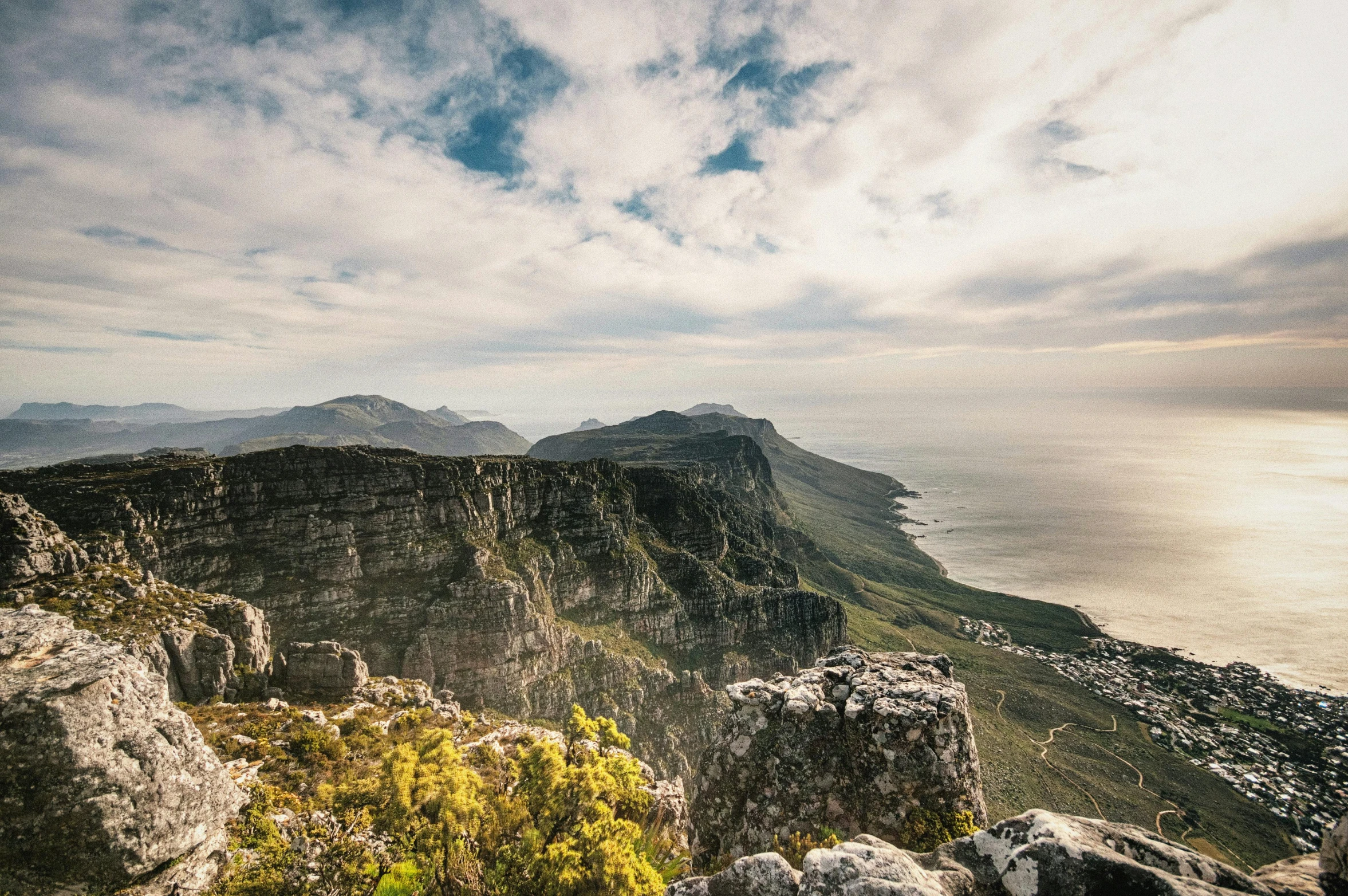 a view of the ocean from the top of a mountain, by Daniel Lieske, pexels contest winner, baroque, royal cape, two mountains in background, fine art print, cliffs