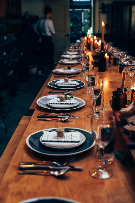 a long wooden table topped with plates and silverware, by Sebastian Vrancx, pexels contest winner, candlelit, 15081959 21121991 01012000 4k, amanda lilleston, delicious