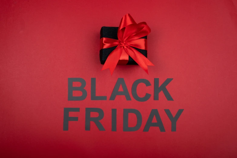 a black friday sign with a red bow on it, by Kristian Zahrtmann, hurufiyya, all black matte product, frank frazzetta, on a canva, drone photo