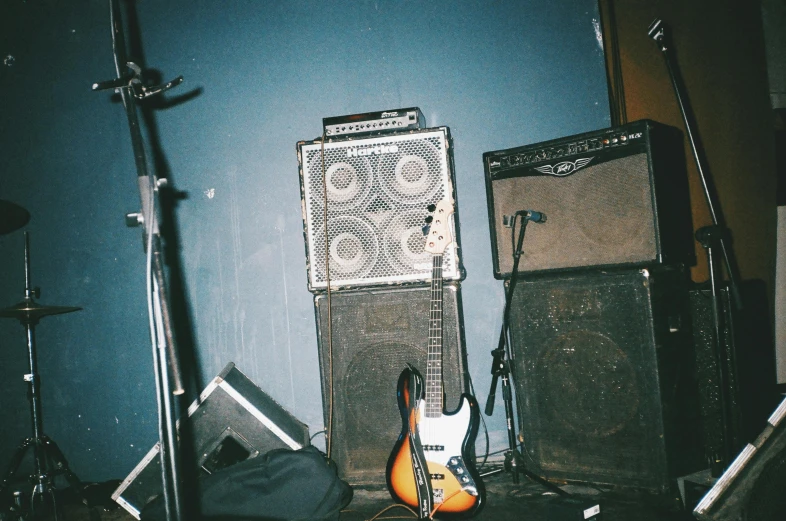 a group of musical equipment sitting on top of a floor, an album cover, inspired by Elsa Bleda, unsplash, massurrealism, stage speakers, 1990's photo, stoner rock concert, very pale