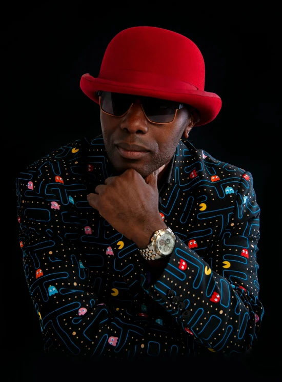 a man wearing a red hat and jacket, inspired by Clifford Ellis, funk art, lance reddick, press photo, bright on black, 15081959 21121991 01012000 4k