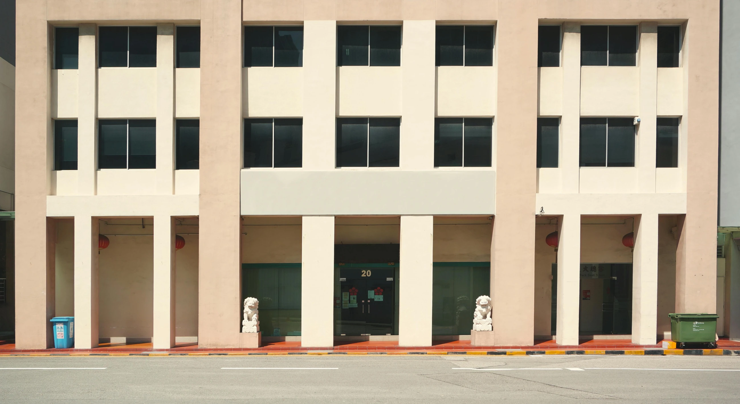 a building with a parking lot in front of it, unsplash, bengal school of art, lim chuan shin, street elevation, front view 2 0 0 0, entrance