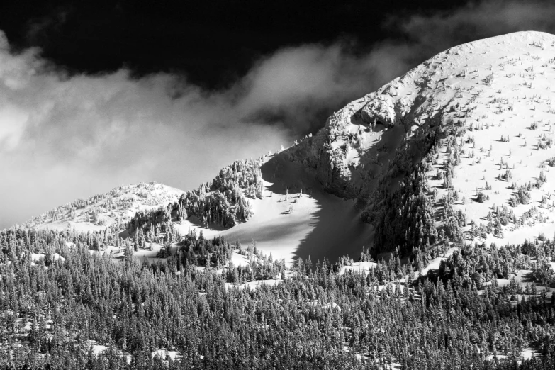 a black and white photo of a snow covered mountain, a black and white photo, inspired by Ansel Adams, unsplash contest winner, ominous! landscape of north bend, : psychedelic ski resort, monochrome color, harsh light and shadow