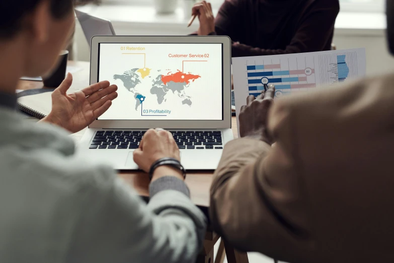 a group of people sitting around a table with a laptop, a digital rendering, by Daniel Schultz, trending on pexels, continents, power bi dashboard, thumbnail, teaser