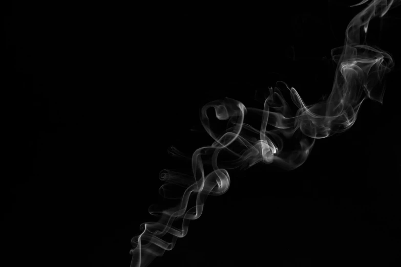 a close up of smoke on a black background, a black and white photo, by Emma Andijewska, pexels, minimalism, flowing tendrils, graffiti _ background ( smoke ), cigarette dangling, swoosh