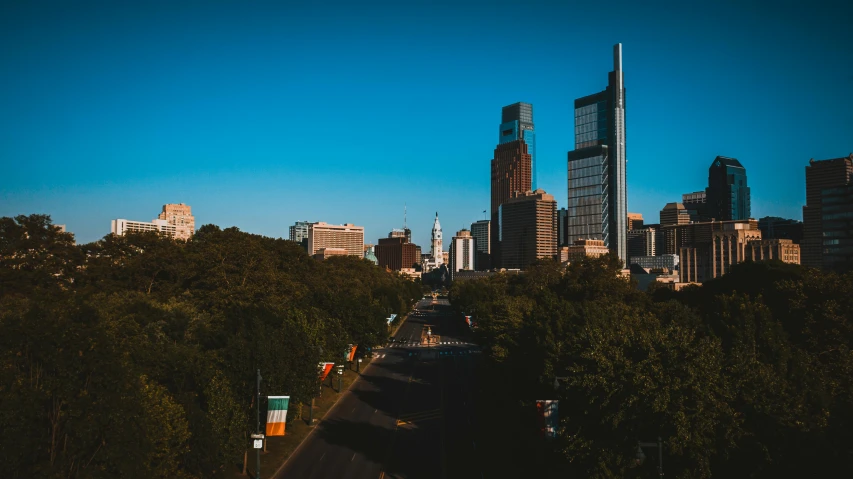 a view of a city from the top of a hill, pexels contest winner, new jersey, city street, sharp high quality photo, background image