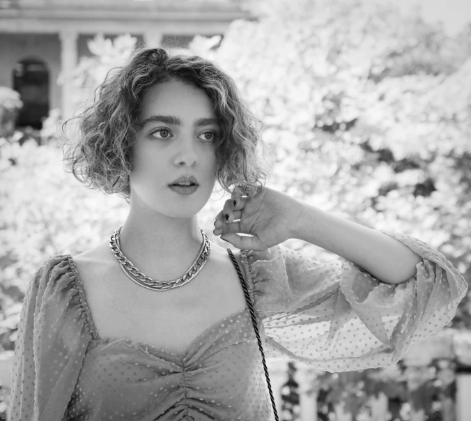 a black and white photo of a woman talking on a phone, rococo, sophia lillis, instagram post, chaumet style, ana de armas portrait