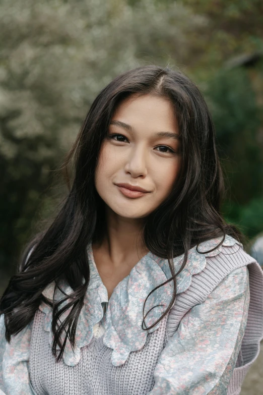 a woman sitting on a bench in a park, an album cover, inspired by Li Di, trending on pexels, renaissance, gemma chan girl portrait, malaysian, headshot profile picture, lovingly looking at camera