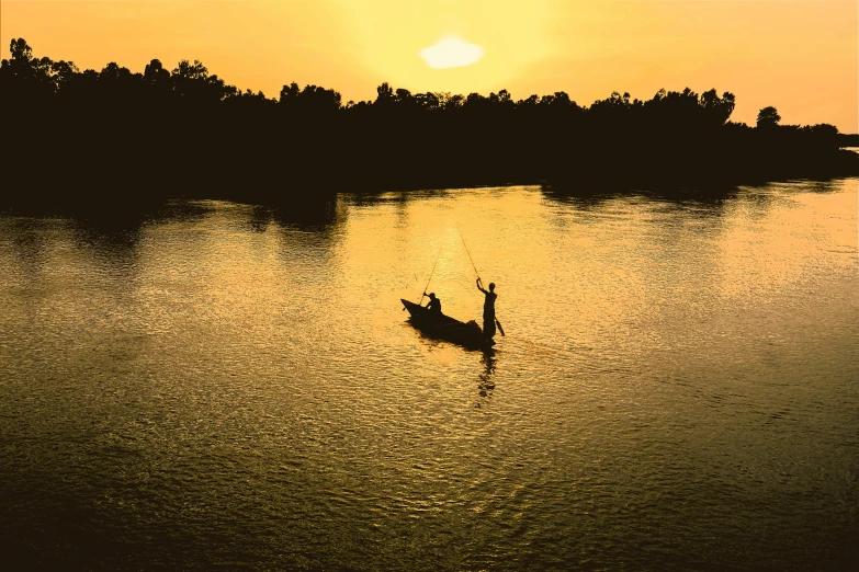 a person in a boat on a body of water, at the golden hour, fishing, lagoon, lachlan bailey