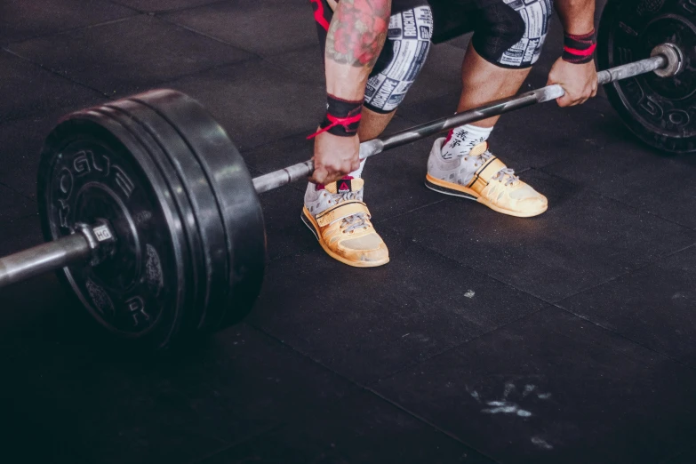 a man squatting on a barbell in a gym, pexels contest winner, battle shoes, avatar image, background image