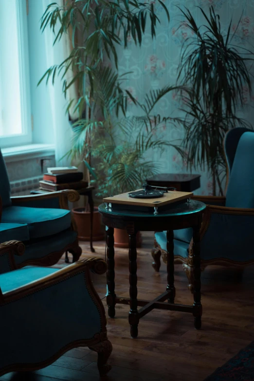 a living room filled with furniture next to a window, an album cover, inspired by Elsa Bleda, pexels contest winner, neoclassicism, blue and cyan scheme, andrey tarkovsky, comfy chairs, gentleman's club lounge