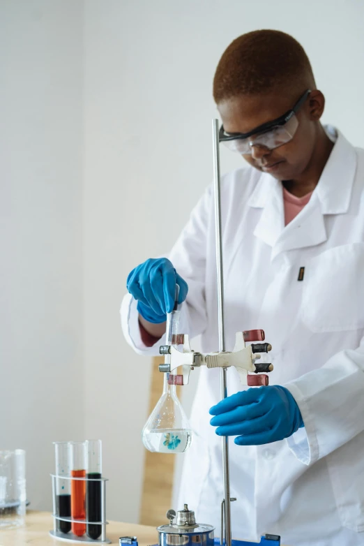 a man in a white lab coat and blue gloves, shutterstock, photo of a black woman, fluids, 15081959 21121991 01012000 4k, balancing the equation