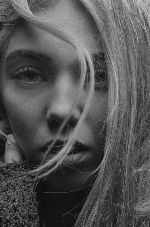 a black and white photo of a woman with long hair, pexels contest winner, sydney sweeney, close - up of face, windswept, monochrome 3 d model