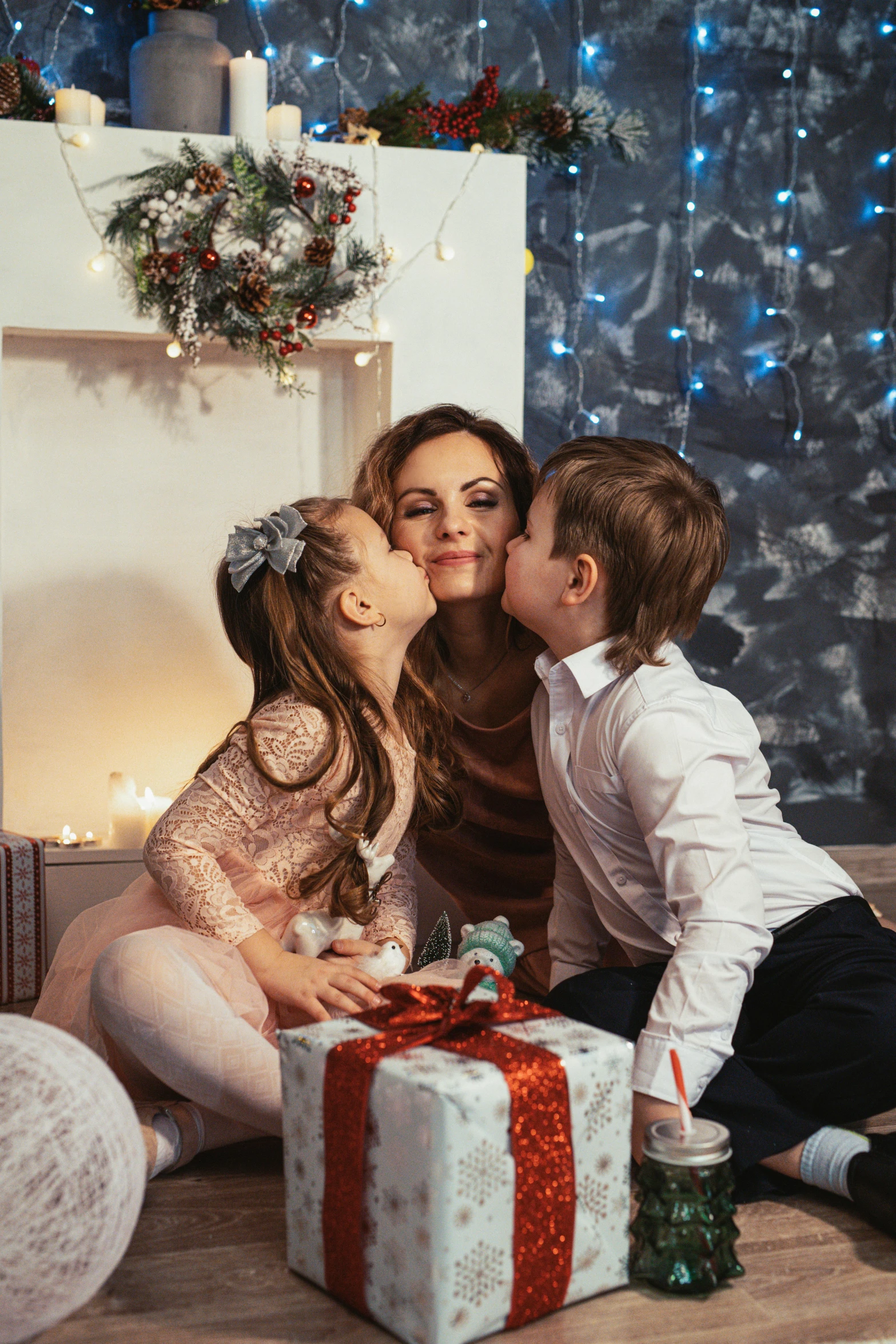 a woman and two children sitting in front of a christmas tree, kissing together cutely, elegantly, netflix, profile image