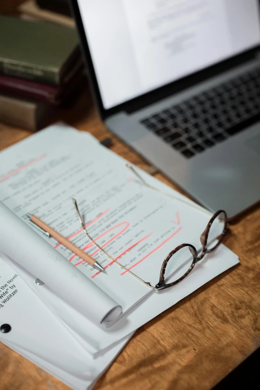 a laptop computer sitting on top of a wooden desk, by Carey Morris, unsplash, academic art, with notes, scientific paper, forms, paul barson