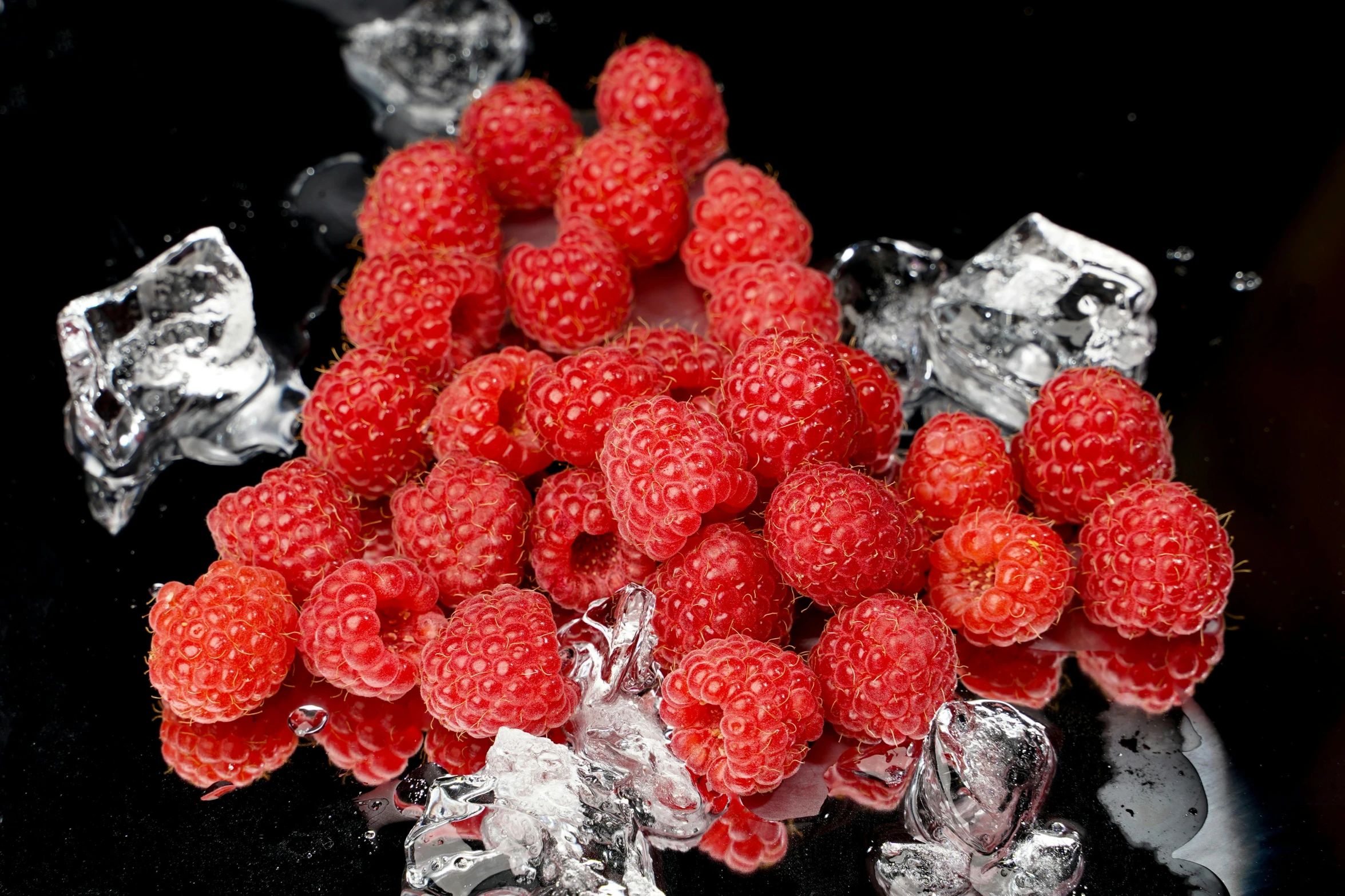 a pile of raspberries sitting on top of ice, by Arthur Sarkissian, gelatine silver process, silver red, ready to eat, superior quality