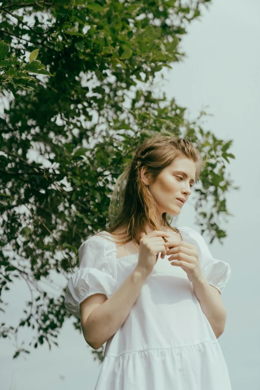 a woman in a white dress standing next to a tree, profile image, 2019 trending photo, promotional image, girl with brown hair