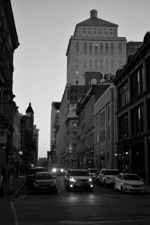 a black and white photo of a city street, inspired by Pierre Toutain-Dorbec, renaissance, at twilight, downtown, july 2 0 1 1, old city