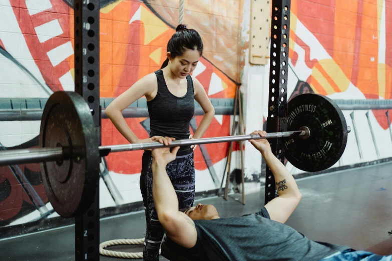 a man and a woman doing squats in a gym, by Sam Black, pexels contest winner, hurufiyya, lifting weights, mai anh tran, charli bowater and artgeem, background image