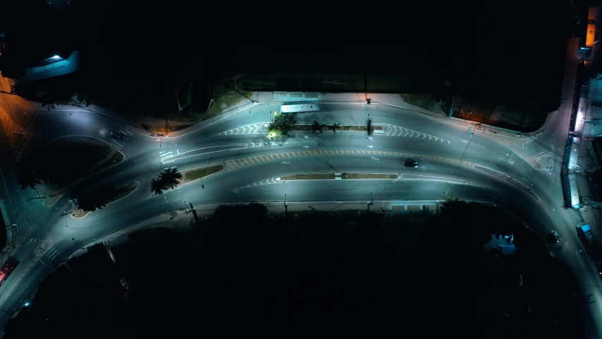 an aerial view of an intersection at night, unsplash contest winner, photorealism, ignacio fernandez rios ”, taken on a 2010s camera, hyperrealistic”, oceanside