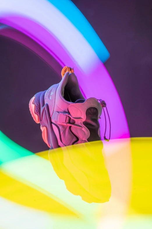 a pair of sneakers sitting on top of a table, inspired by Jeff Koons, trending on unsplash, conceptual art, purple and yellow lighting, colorful redshift render, salomon, halo / nimbus