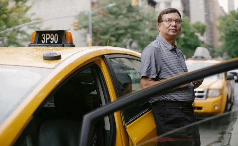 a man standing next to a yellow taxi cab, paul lung, ranjit ghosh, avatar image