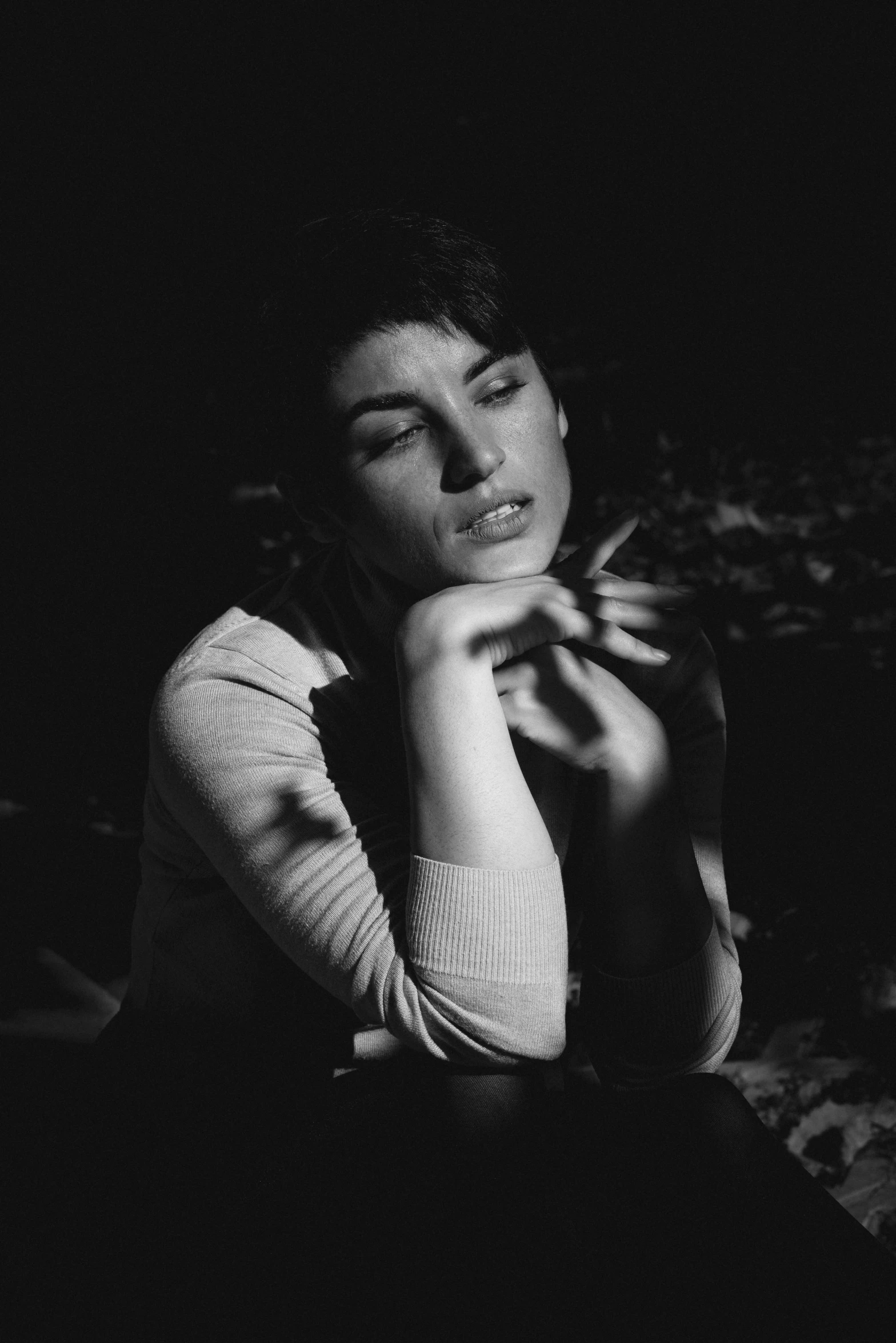 a black and white photo of a woman sitting on a couch, by Peter Basch, tumblr, smoking a cigarette in the field, sherilyn fenn 2 2 years old, bokeh. i, 15081959 21121991 01012000 4k