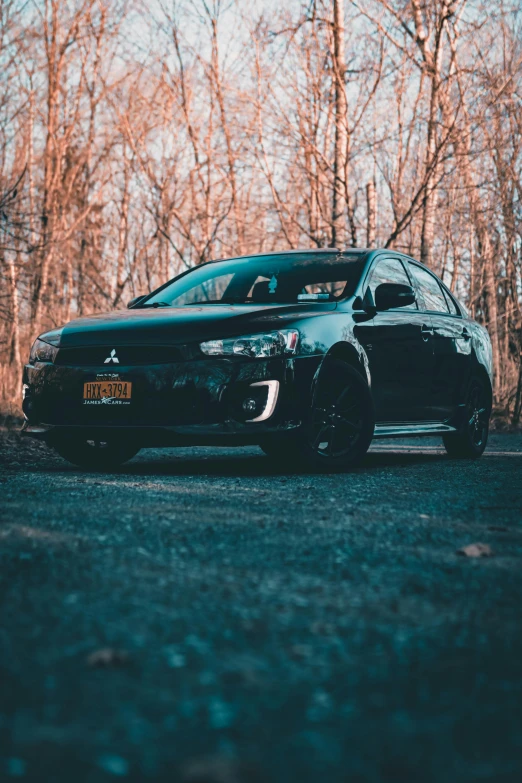 a black car parked on the side of a road, profile picture, sports photo, shot on sony a 7, vehicles