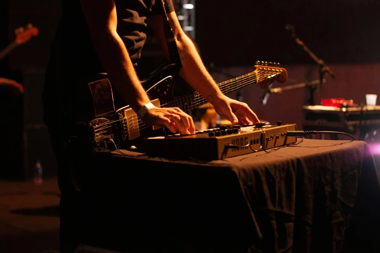 a close up of a person playing a musical instrument, stage at a club, lachlan bailey, rectangle, technical