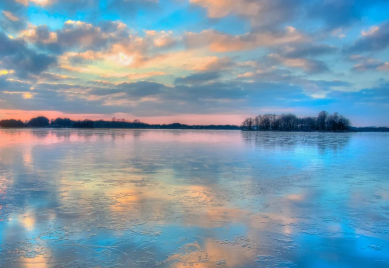 a large body of water under a cloudy sky, by Jan Rustem, pexels contest winner, romanticism, frozen river, blue sky with colorful clouds, from wheaton illinois, shiny gloss water reflections