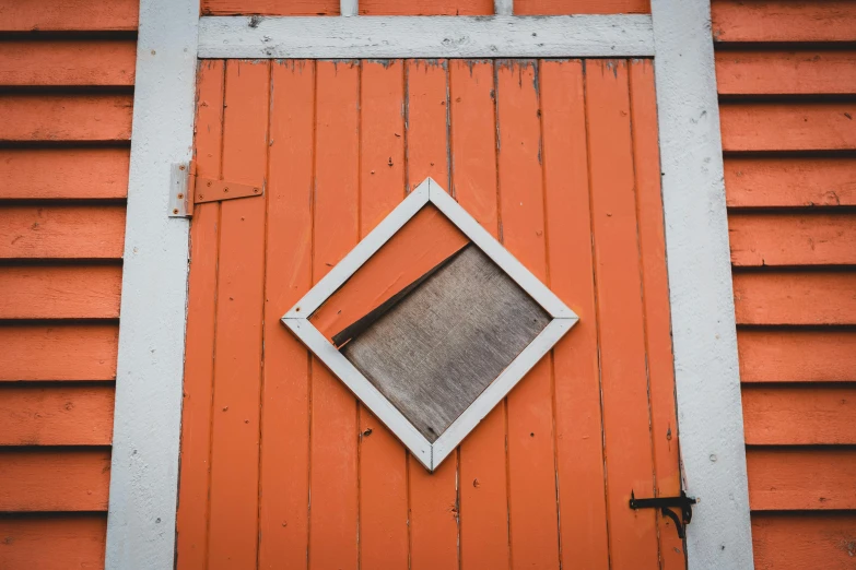 a close up of a door with a window, by Attila Meszlenyi, pexels contest winner, orange gi, square shapes, barn, scandinavian