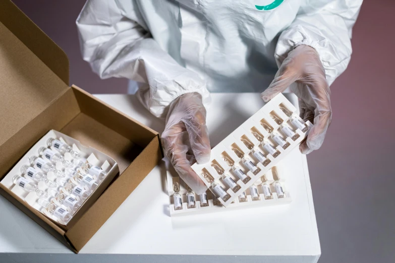 a close up of a person holding a box of pills, by Jason Felix, plasticien, pathology sample test tubes, white and teal garment, twintails white_gloves, thumbnail