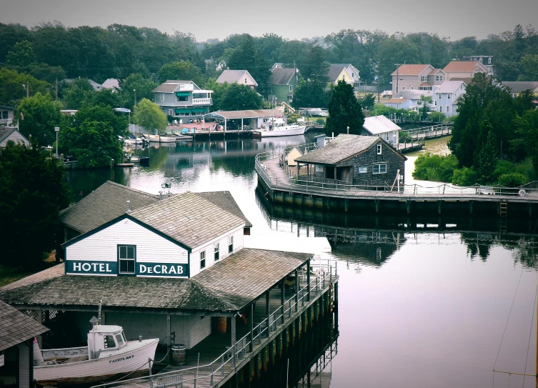 a large body of water with a boat in it, pilgrim village setting, hazy and dreary, amityville, ignant