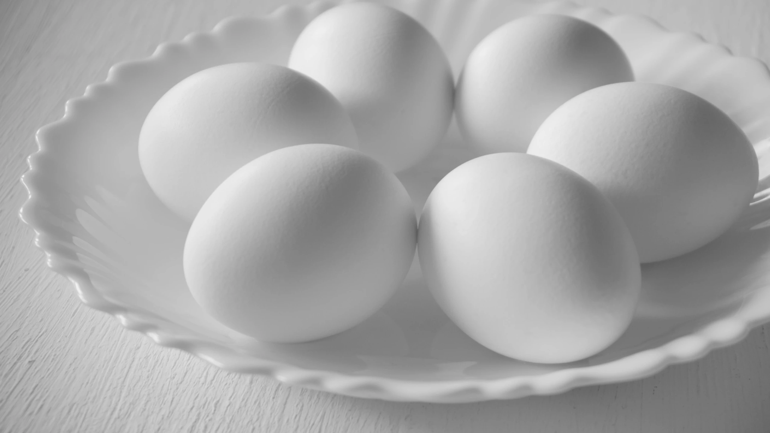 six eggs in a white bowl on a table, an ambient occlusion render, by Jan Kupecký, pexels, white monochrome color!!!!!, hd footage, close up food photography, round-cropped