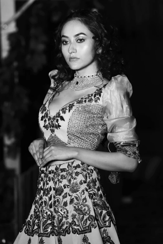 a black and white photo of a woman in a dress, inspired by Zhang Yin, rococo, assamese aesthetic, monochrome:-2, nina dobrev, candid photograph
