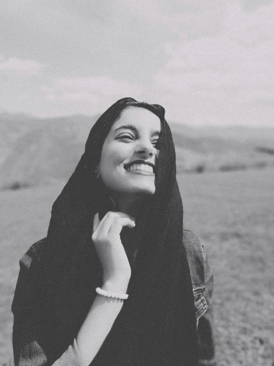 a black and white photo of a woman smiling, pexels contest winner, maya ali wind sorcerer, ☁🌪🌙👩🏾, young himalayan woman, instagram post