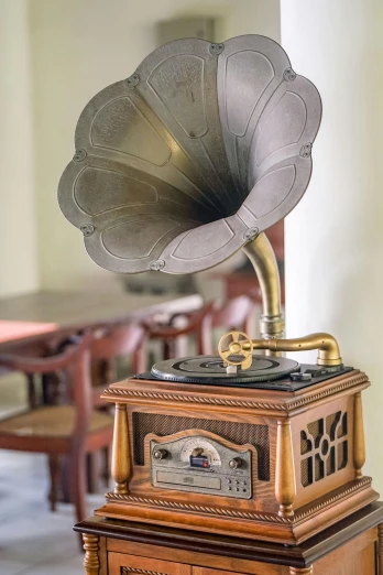a gramphone sitting on top of a wooden table