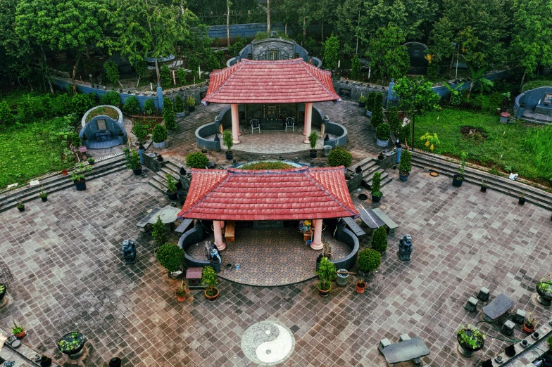 a gazebo sitting in the middle of a lush green park, by Jan Rustem, kerala village, birds - eye view, fountains and arches, vietnamese temple scene