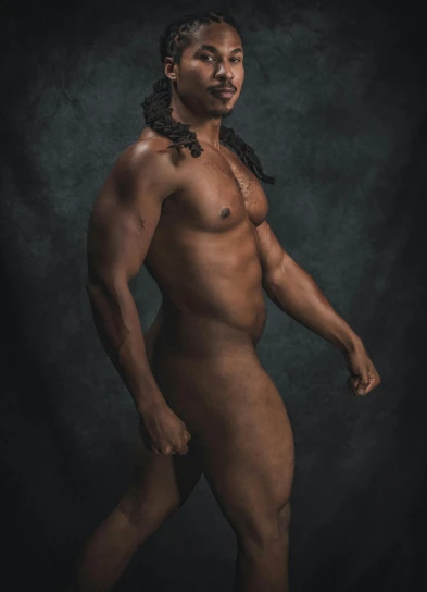 a naked man standing in front of a black background, an album cover, by Hercules Seghers, reddit, light brown skin!, upscale photo, curves!!, highly realistic photo realistic