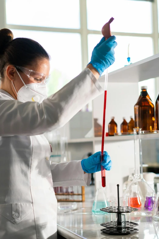 a woman in a lab coat holding a pipe, reagents, spraying liquid, premium quality, thumbnail