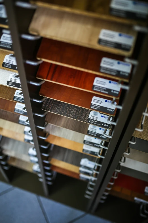 a room filled with lots of different types of flooring, a picture, unsplash, bauhaus, labels, shot on sony a 7, shelf, brown