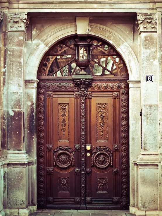 a close up of a wooden door on a building, an album cover, pexels contest winner, baroque, old picture, barcelona, narnia, ornate retreat