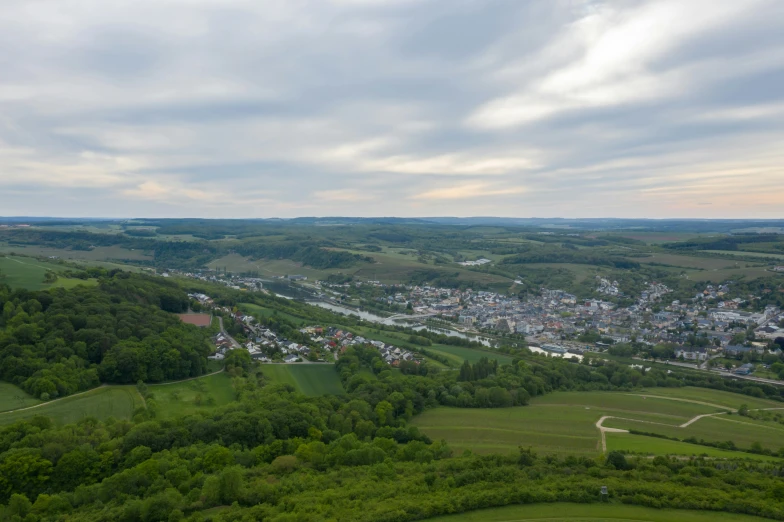 a view of a town from the top of a hill, by Matthias Stom, pexels contest winner, happening, eldenring, wide angle river, high detail 4 k, wine
