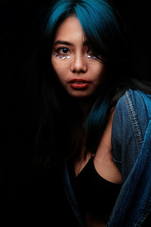 a woman with blue hair wearing a denim jacket, inspired by Elsa Bleda, pexels contest winner, hyperrealism, south east asian with round face, skin made of led point lights, 🤤 girl portrait, young asian girl