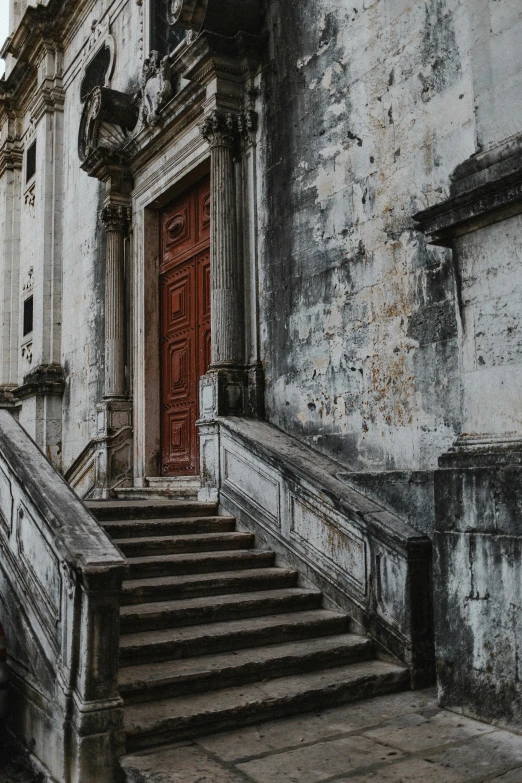 a building with a bunch of stairs in front of it, pexels contest winner, baroque, blood stains on the walls, about to enter doorframe, 2019 trending photo, religious